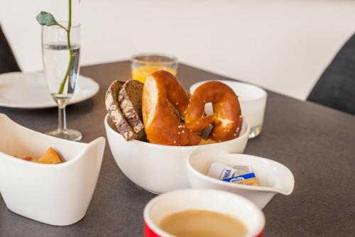 a bowl of pretzels and bread on a table at bichl 761 in Fischen