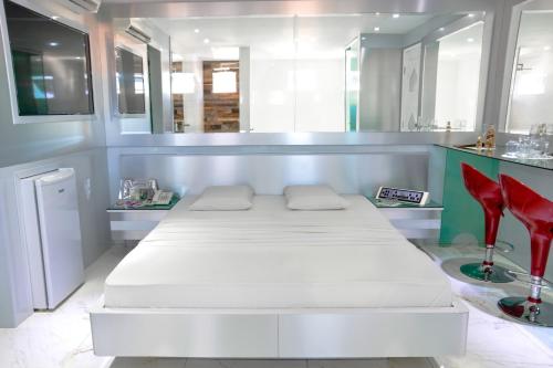 Postel nebo postele na pokoji v ubytování MOTEL LIBIDUS - Foz do Iguaçu