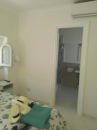 a hotel room with a bed and a bathroom at Casa Gaia in Capri