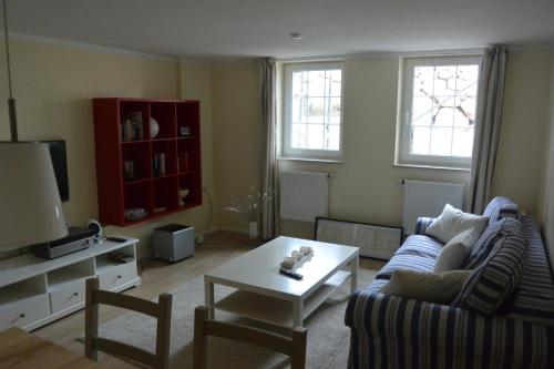 a living room with a couch and a coffee table at Ferienwohnung am Meer in Scharbeutz