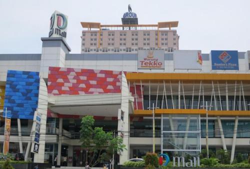 a large building with a hotel in the background at Wjy Apartment Margonda Residence 5 in Depok