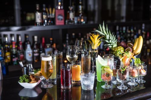 a bar with glasses of champagne and food on a table at Rihga Royal Gran Okinawa in Naha