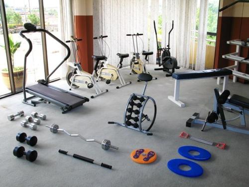 a gym with a bunch of exercise equipment on the floor at Good Hope Hotel in Skudai