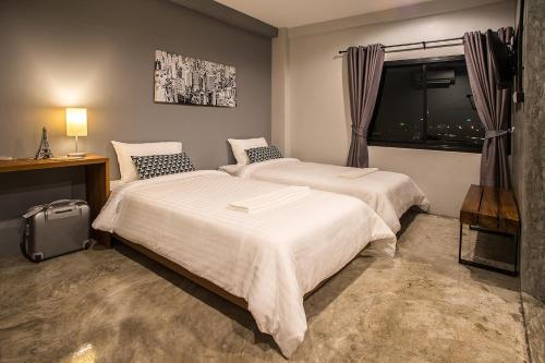 Ένα ή περισσότερα κρεβάτια σε δωμάτιο στο Sleep Station