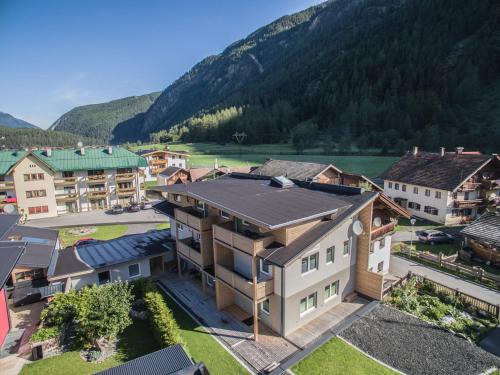 an aerial view of a town with a mountain at Alpenapart Frank in Längenfeld