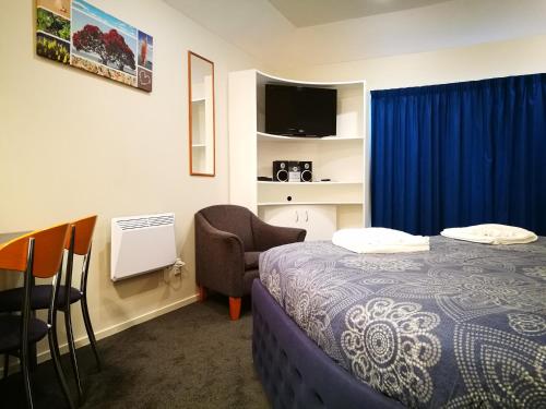 מיטה או מיטות בחדר ב-Airport Birches Motel