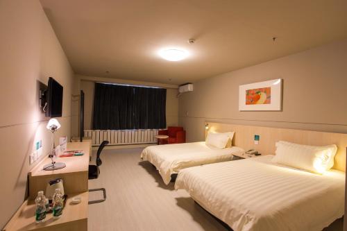 Krevet ili kreveti u jedinici u okviru objekta Jinjiang Inn Tianjin Xinkai Road