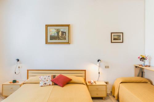 Кровать или кровати в номере Hotel Cristina