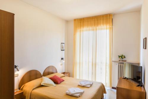 Кровать или кровати в номере Hotel Cristina