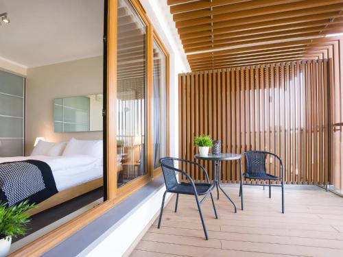 Posteľ alebo postele v izbe v ubytovaní VacationClub - Olympic Park Apartment 404