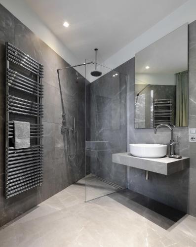 a bathroom with a sink and a shower at Laglio Como Lake Resort in Laglio