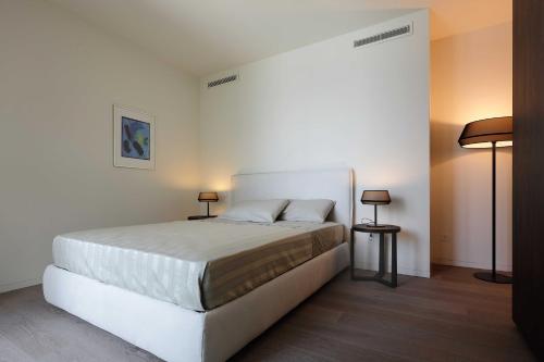 Säng eller sängar i ett rum på Laglio Como Lake Resort