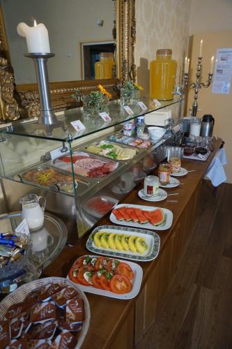 a buffet line with many different types of food at Hotel Holsteinische Schweiz am Dieksee in Malente