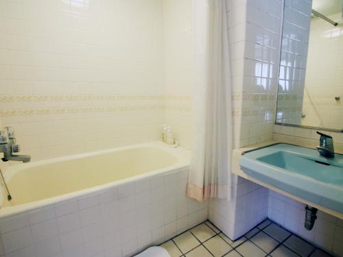 Ett badrum på Misasa Royal Hotel