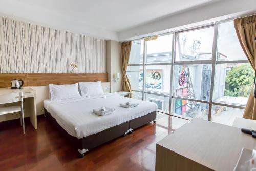 Postel nebo postele na pokoji v ubytování Snooze Hotel Thonglor Bangkok