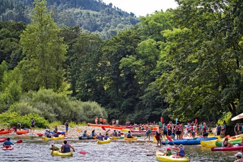 a group of people in kayaks on a river at Conjunto Hotelero La Pasera in Soto de Cangas
