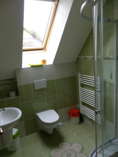 a bathroom with a toilet and a sink at Privát Obuvník in Liptovský Ján