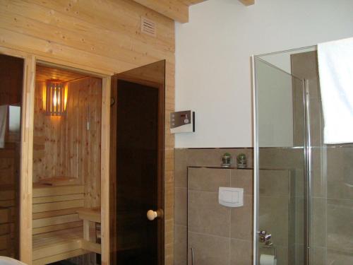 a bathroom with a shower and a glass door at Strandlust in Petersfeld