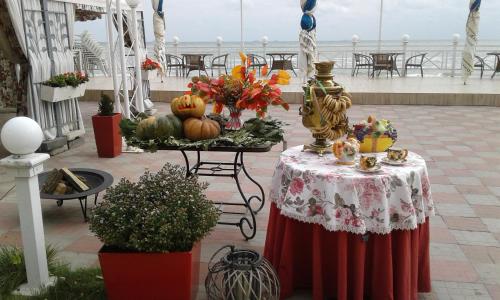 a table with pumpkins on it on a patio at Shalanda in Odesa