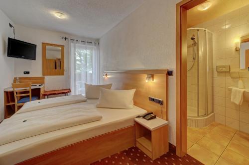Ένα ή περισσότερα κρεβάτια σε δωμάτιο στο Hotel Post
