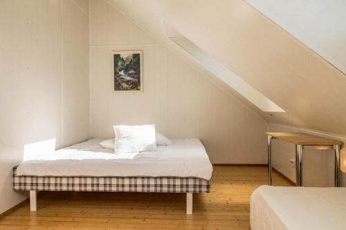 a bedroom with a bed in a attic at Alevi Holiday Home with Sauna in Tallinn