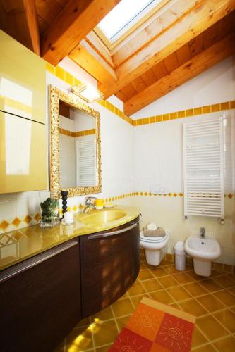 a bathroom with a sink and a toilet at Apartment Theresa in Tremezzo