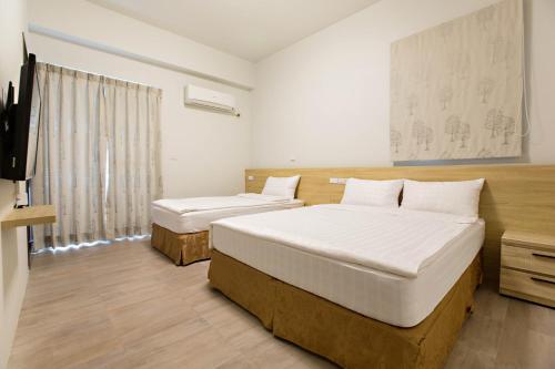 Tempat tidur dalam kamar di Success 66 B&B