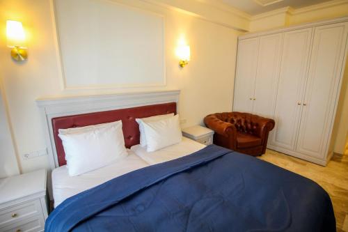 Postel nebo postele na pokoji v ubytování Grand Hotel Palladium