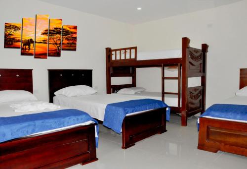 a bedroom with two bunk beds and a ladder at Hotel Arce Plaza in Valledupar