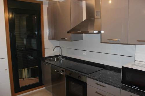 Kuchyň nebo kuchyňský kout v ubytování Costa Reinante Spa