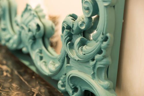 a close up of a blue mirror on a wall at Altavilla Boutique Hotel in Catanzaro