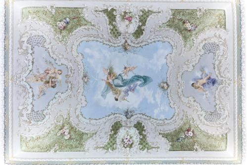 a painting of a cherub on a ceiling at Palazzo Favacchio - Patanè in Scicli