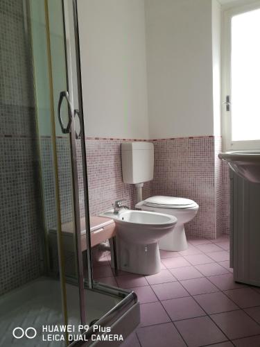 a bathroom with a toilet and a bidet at Costaguta Apartment in Rapallo