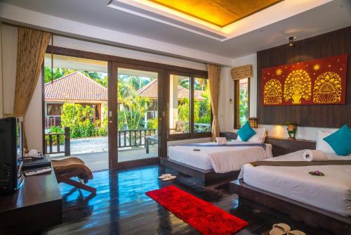 Postel nebo postele na pokoji v ubytování Am Samui Resort Taling Ngam