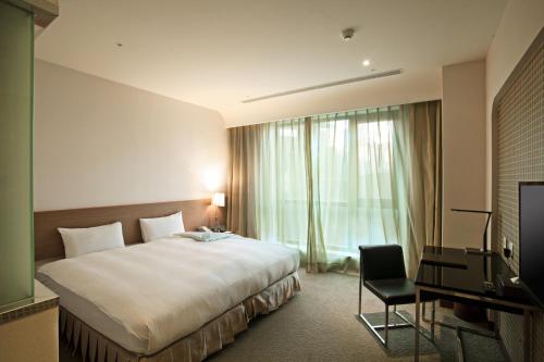Postel nebo postele na pokoji v ubytování Taisugar Hotel Taipei