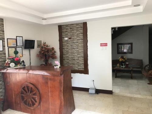 a lobby with a wooden podium in a room at Alzeah's Place Room for Rent in Tagaytay