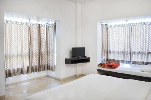 Ένα ή περισσότερα κρεβάτια σε δωμάτιο στο Skyinn Bungalow