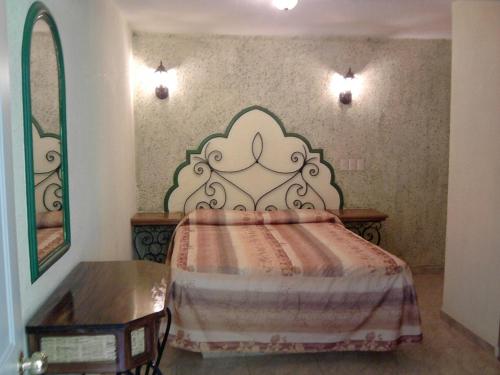 Postel nebo postele na pokoji v ubytování Hotel Coranda