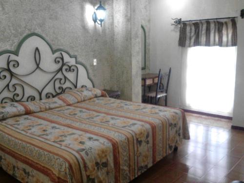 Postel nebo postele na pokoji v ubytování Hotel Coranda