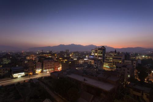a view of a city at night with lights at Traditional Comfort Boutique Hotel in Kathmandu
