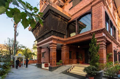 a building with people walking in front of it at Traditional Comfort Boutique Hotel in Kathmandu