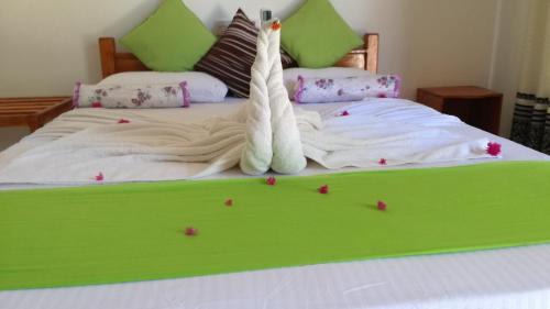 Postel nebo postele na pokoji v ubytování Sigiri Lion Villa