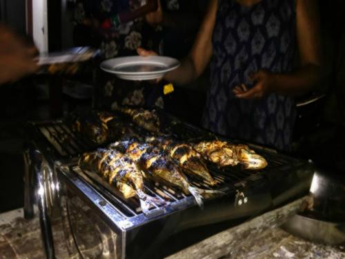 a grill with many different types of food on it at SIlvas Surf Home in Weligama
