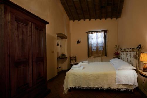 Ένα ή περισσότερα κρεβάτια σε δωμάτιο στο Agriturismo Luggiano