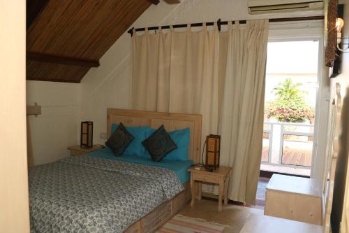 מיטה או מיטות בחדר ב-Villa Soleil D’été
