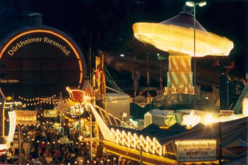 a crowd of people at a carnival at night at Mercure Hotel Bad Duerkheim An Den Salinen in Bad Dürkheim