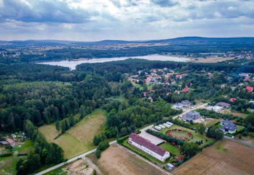 an aerial view of a town and a river at Dom Pod Dębami in Wola Kopcowa