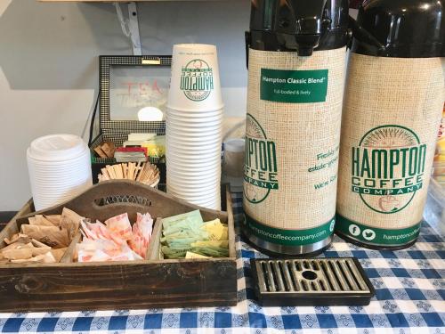 a table topped with a box of food and cups at Shorewood Inn in Jamesport