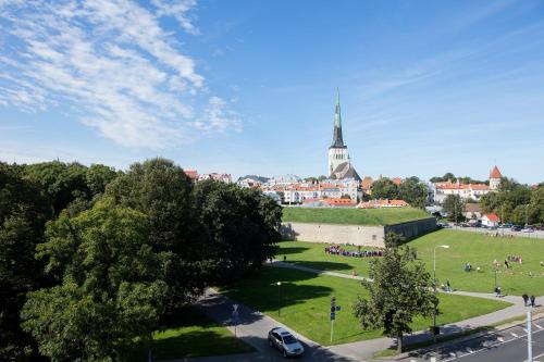 a view of a city with a church in the background at Mere Puiestee Apartment in Tallinn