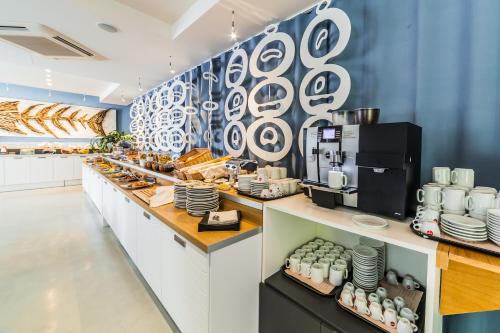 a buffet line in a restaurant with food at Duparc Hotel in Gabicce Mare